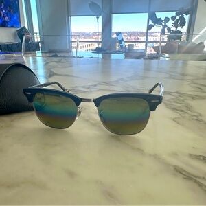 RayBan Clubmaster mirrored sunglasses. Blue frame with tourtise legs.